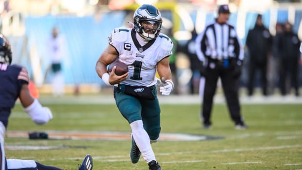 Dec 18, 2022; Chicago, Illinois, USA; Philadelphia Eagles quarterback Jalen Hurts (1) runs the ball in the fourth quarter against the Chicago Bears at Soldier Field.